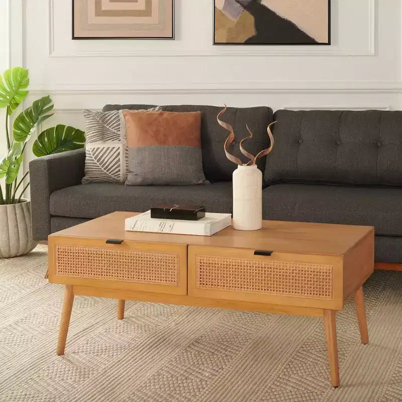 Table basse en bois avec 2 tiroirs et façade en cannage de rotin, pieds fuselés, supporte 68 kg